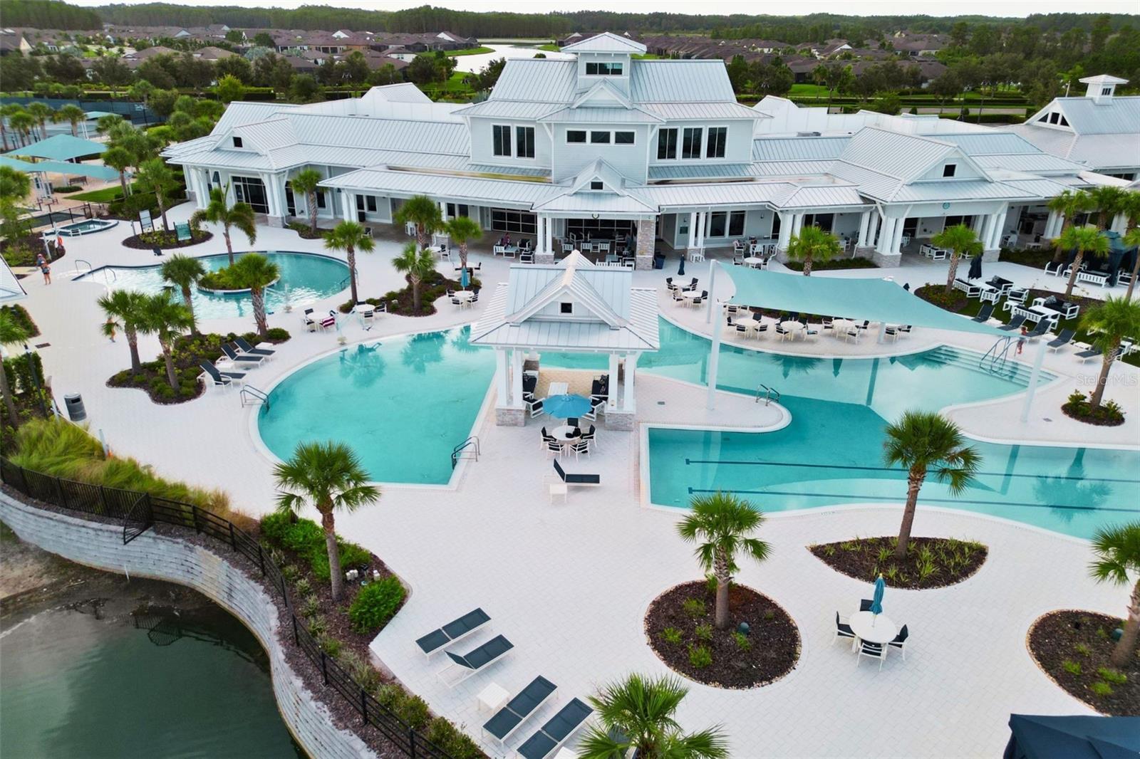 Resort-style pool with lap lanes, resistance pool and plenty of seating.