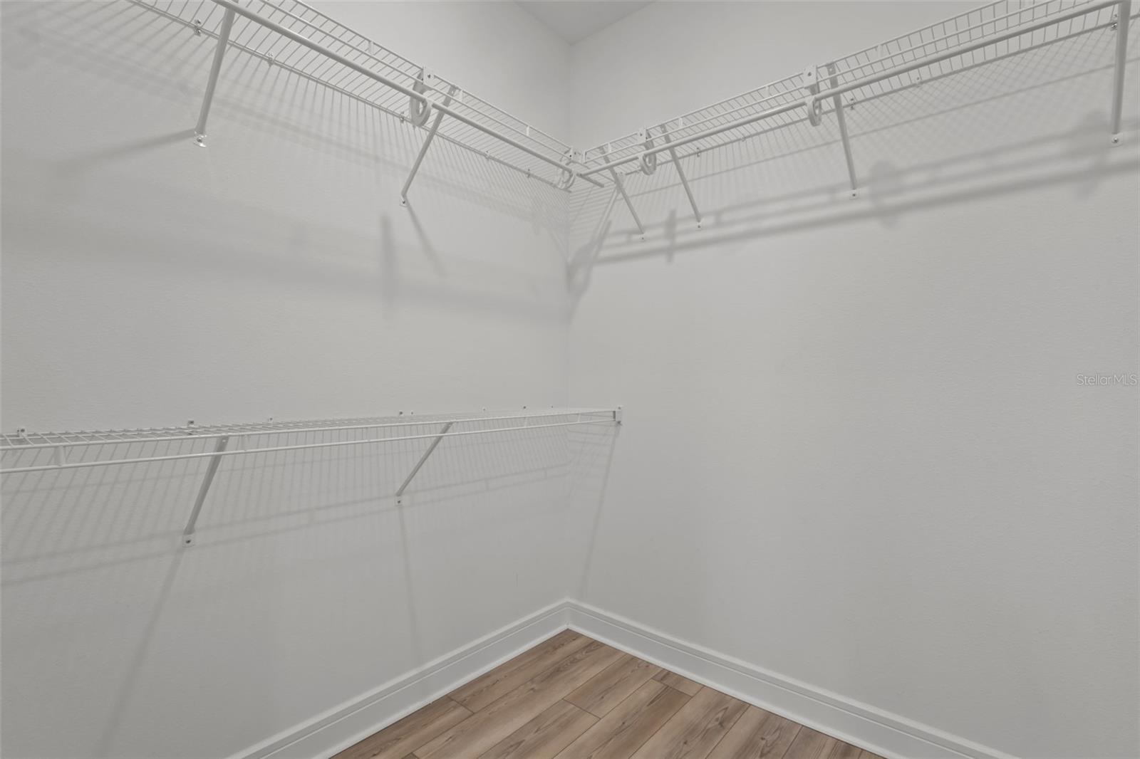Primary bedroom walk in closet