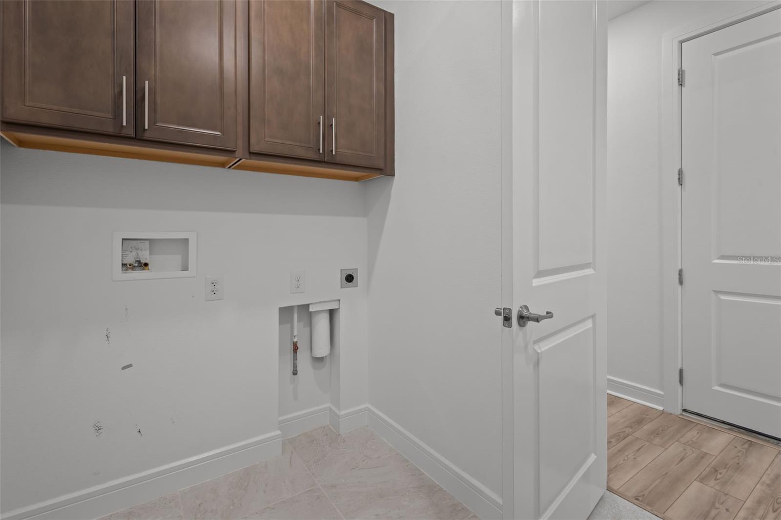 Laundy room (door pictured to the right is to garage)