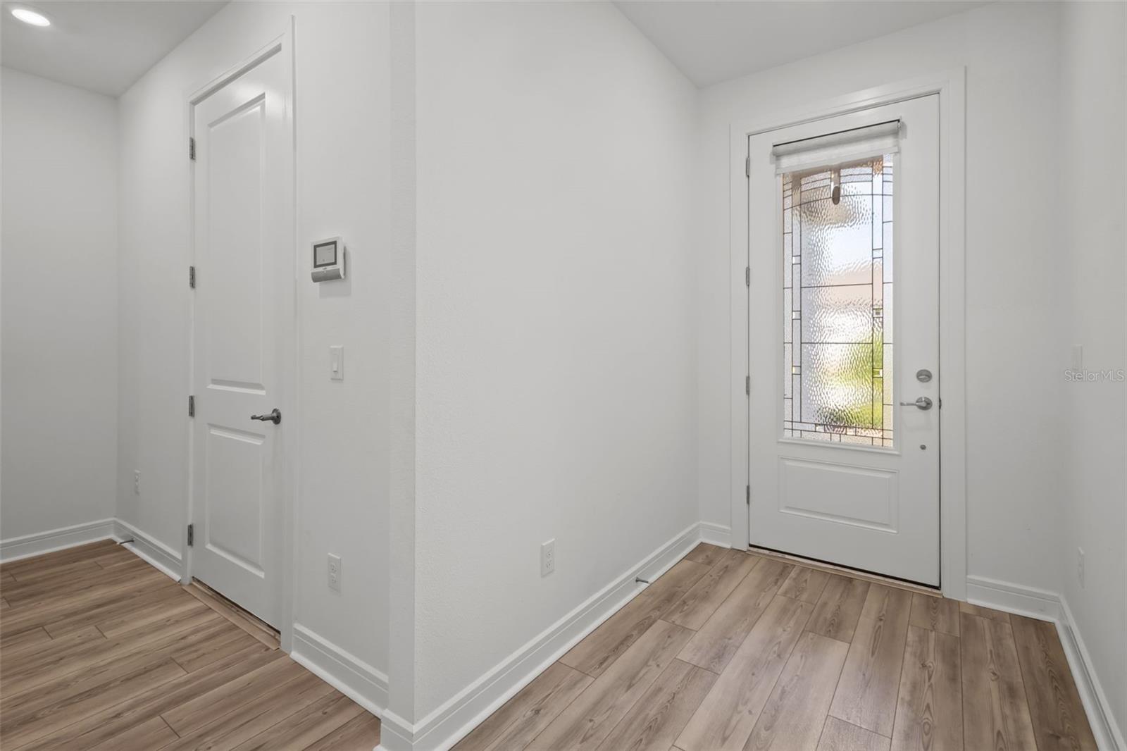 Entry - to the left is the door to tandem garage, laundry room is also to the left