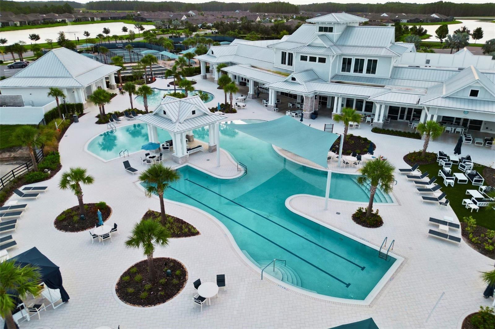 Resort-style pool with lap lanes, resistance pool and plenty of seating.