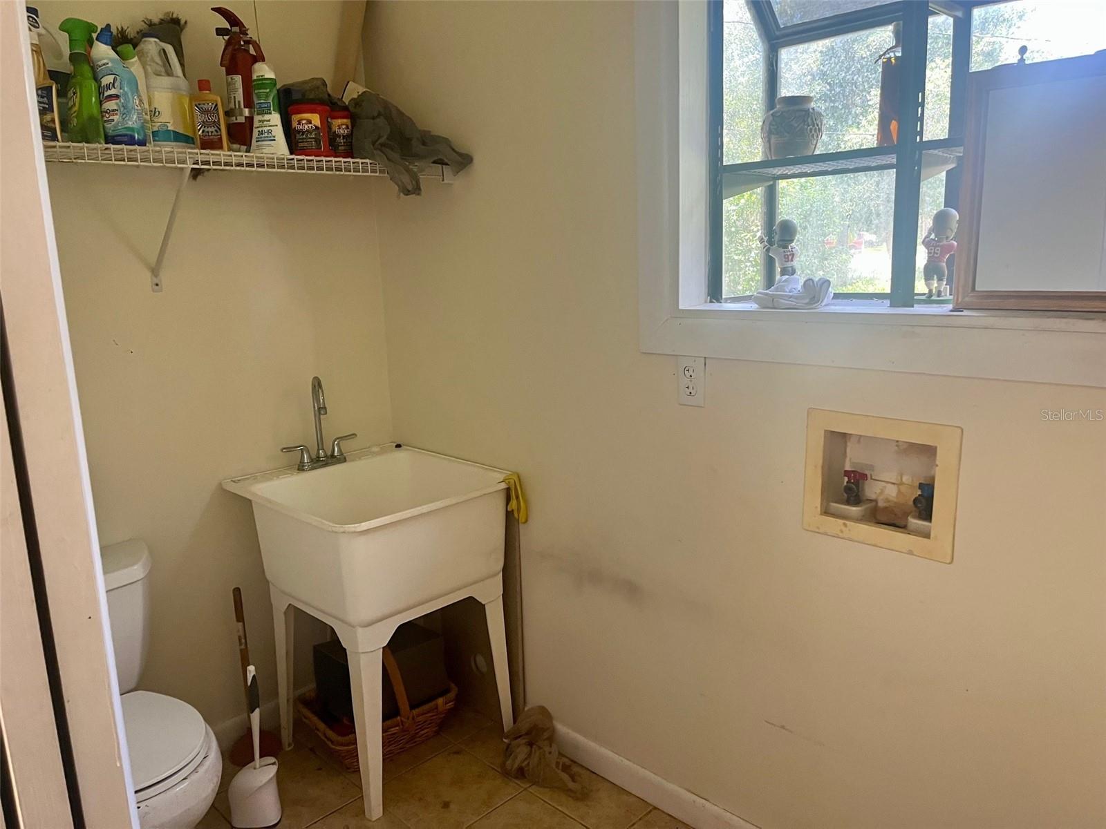 Half bath in laundry room off of kitchen