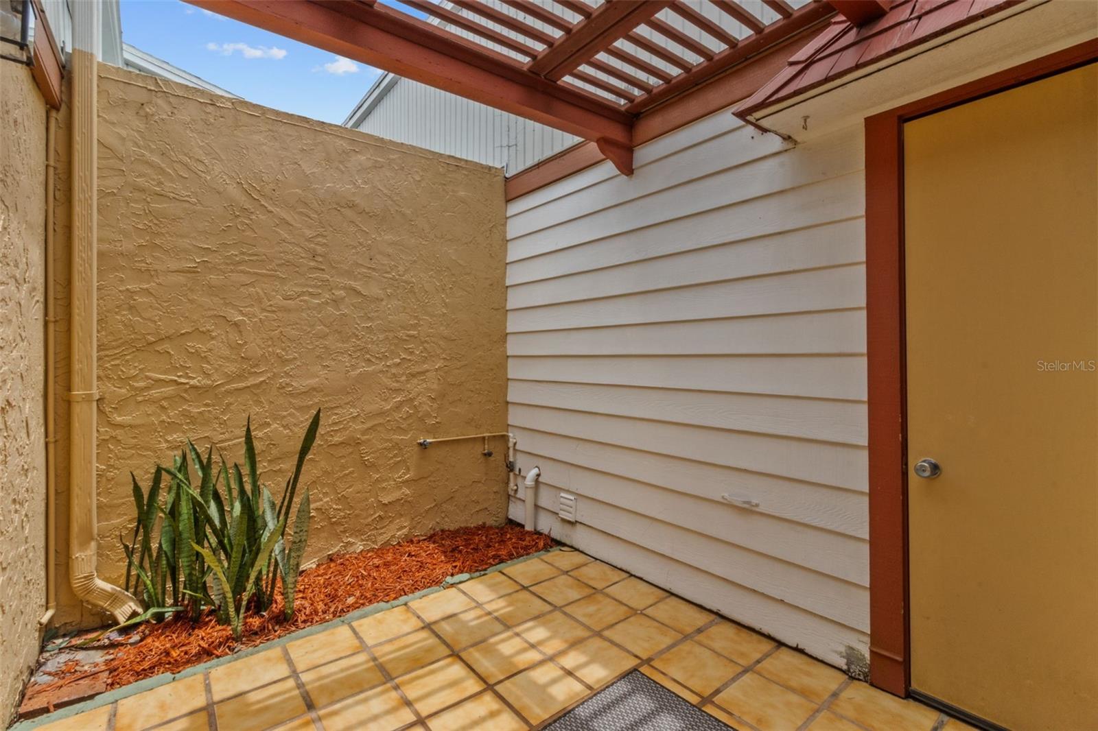 Attrium with rear door access to garage & laundry