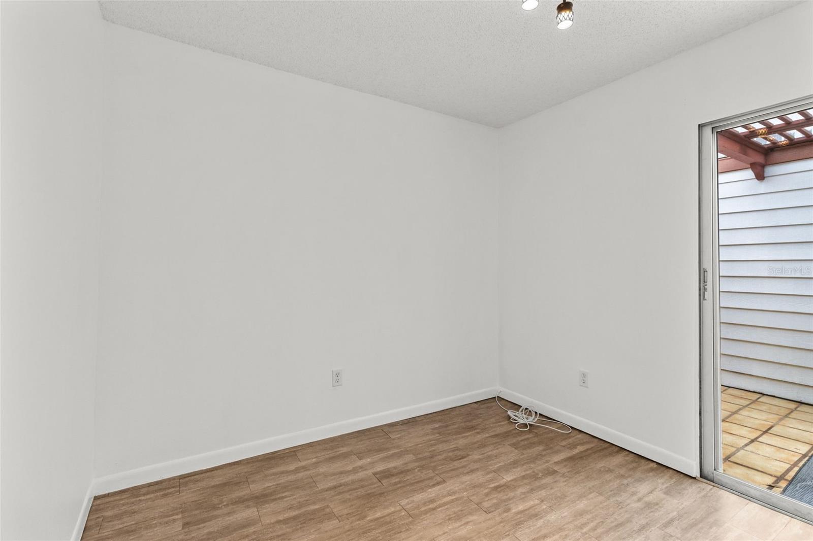 Dinning room with a slider to attrium and rear garage entry