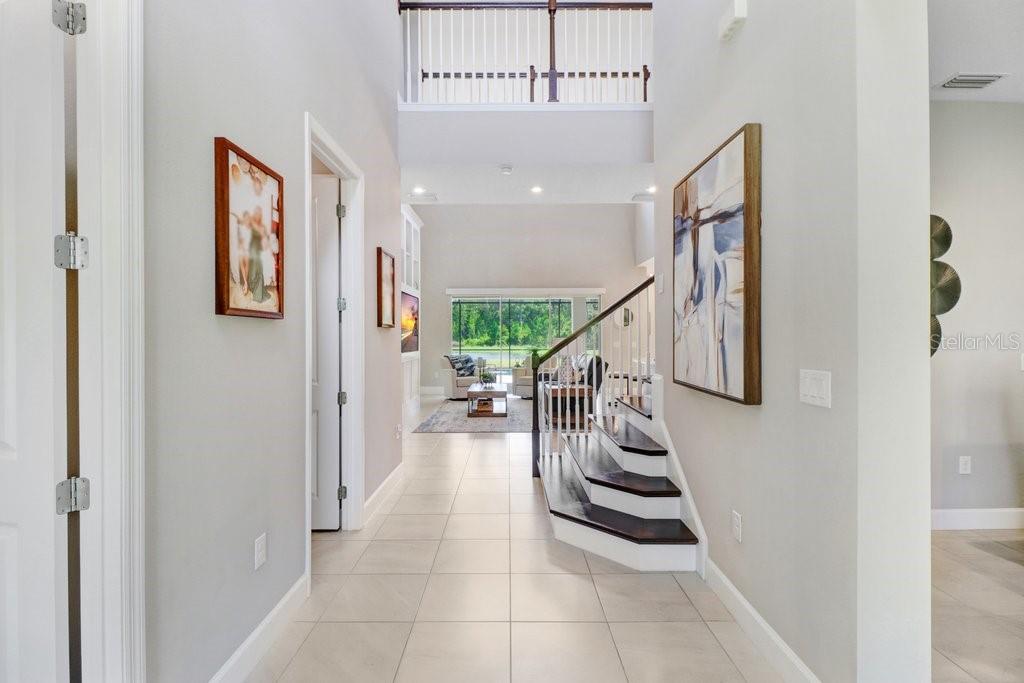Entryway Office to the left, Formal Dining to the right, 1/2 Bath in front of stairs.