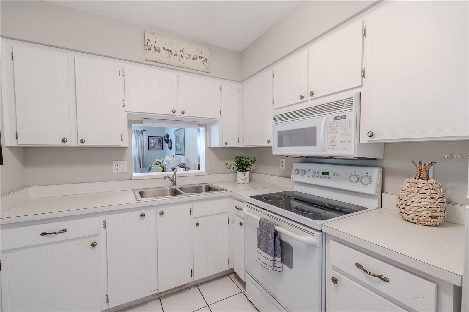 The kitchen boasts a fresh, neutral palette that complements any style and enhances the light, airy feel of the space.