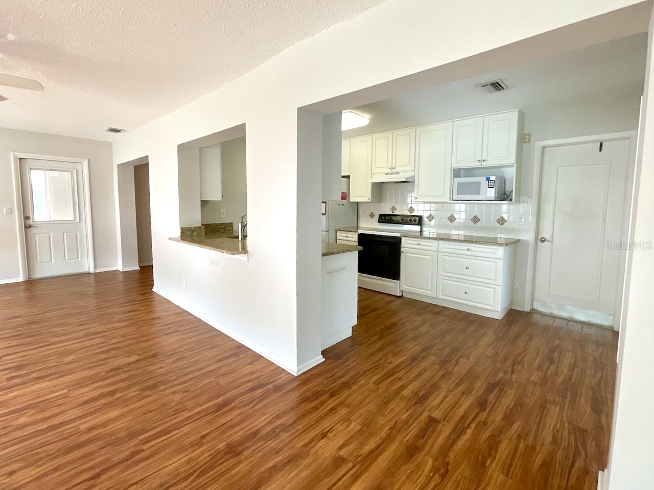Family room view to kitchen
