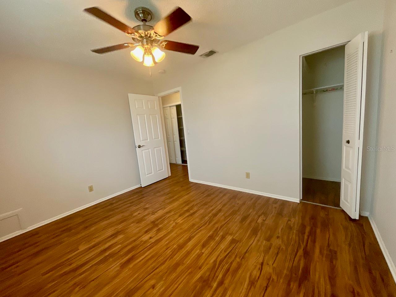 Guest bedroom with walk-in closet