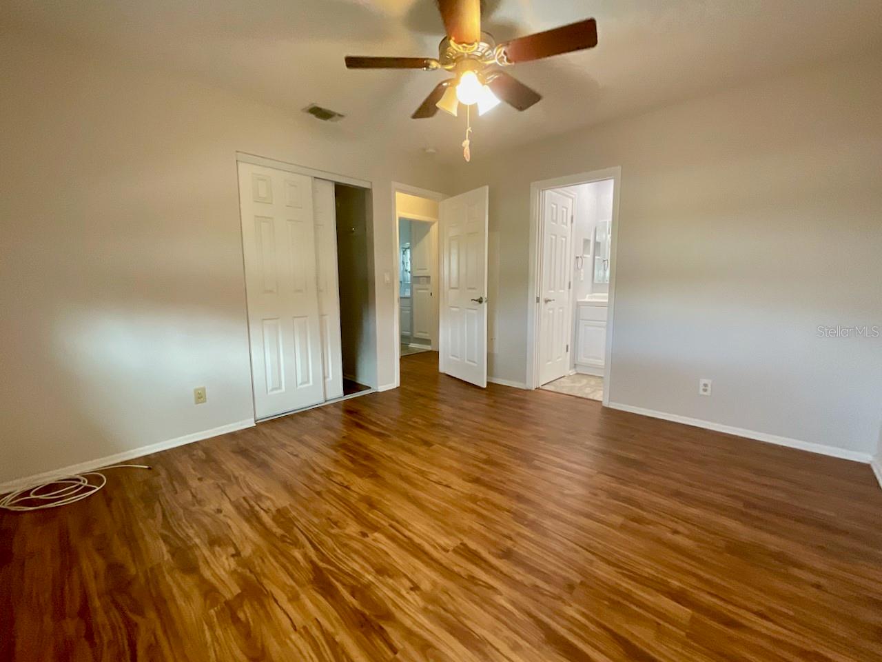 Primary bedroom walk-in closet and bath