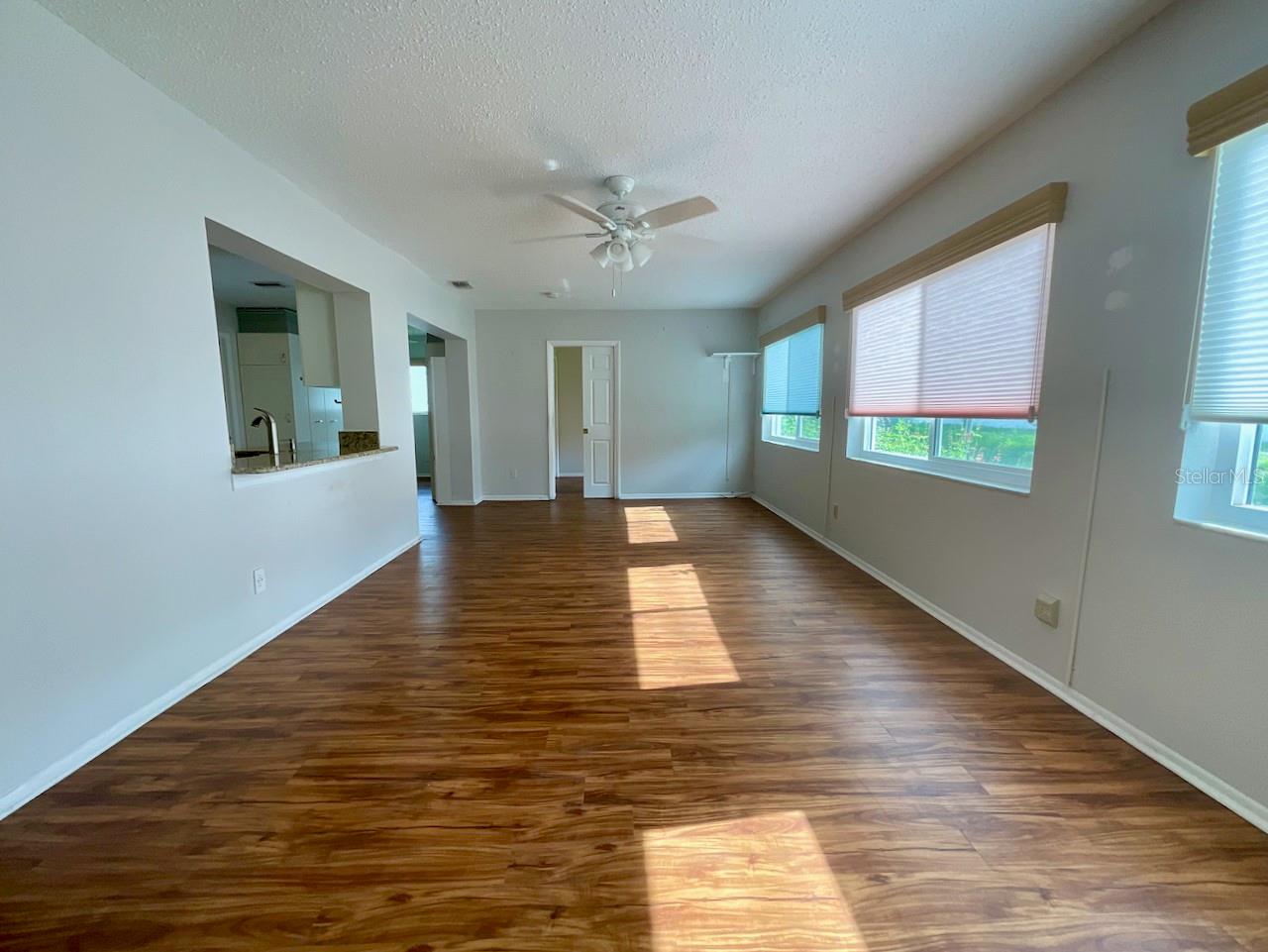 Family room other side with door to a bedroom