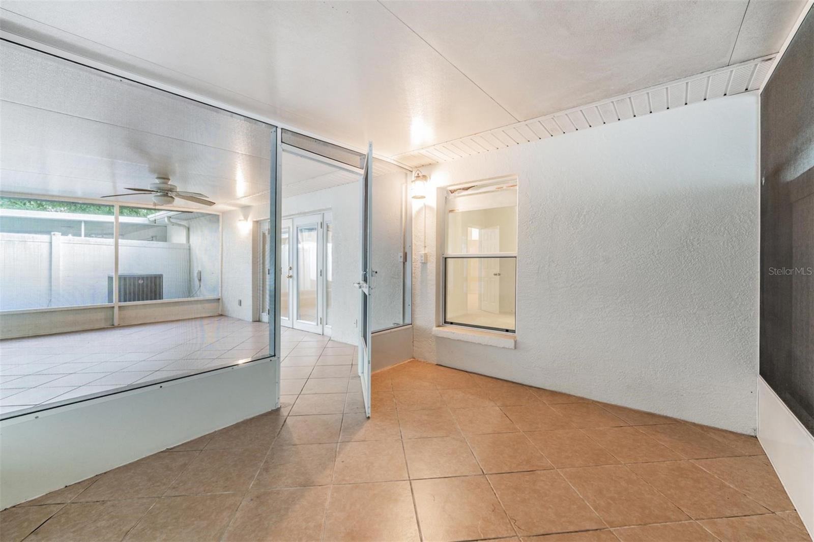 Separate screened patio attached to the larger patio.