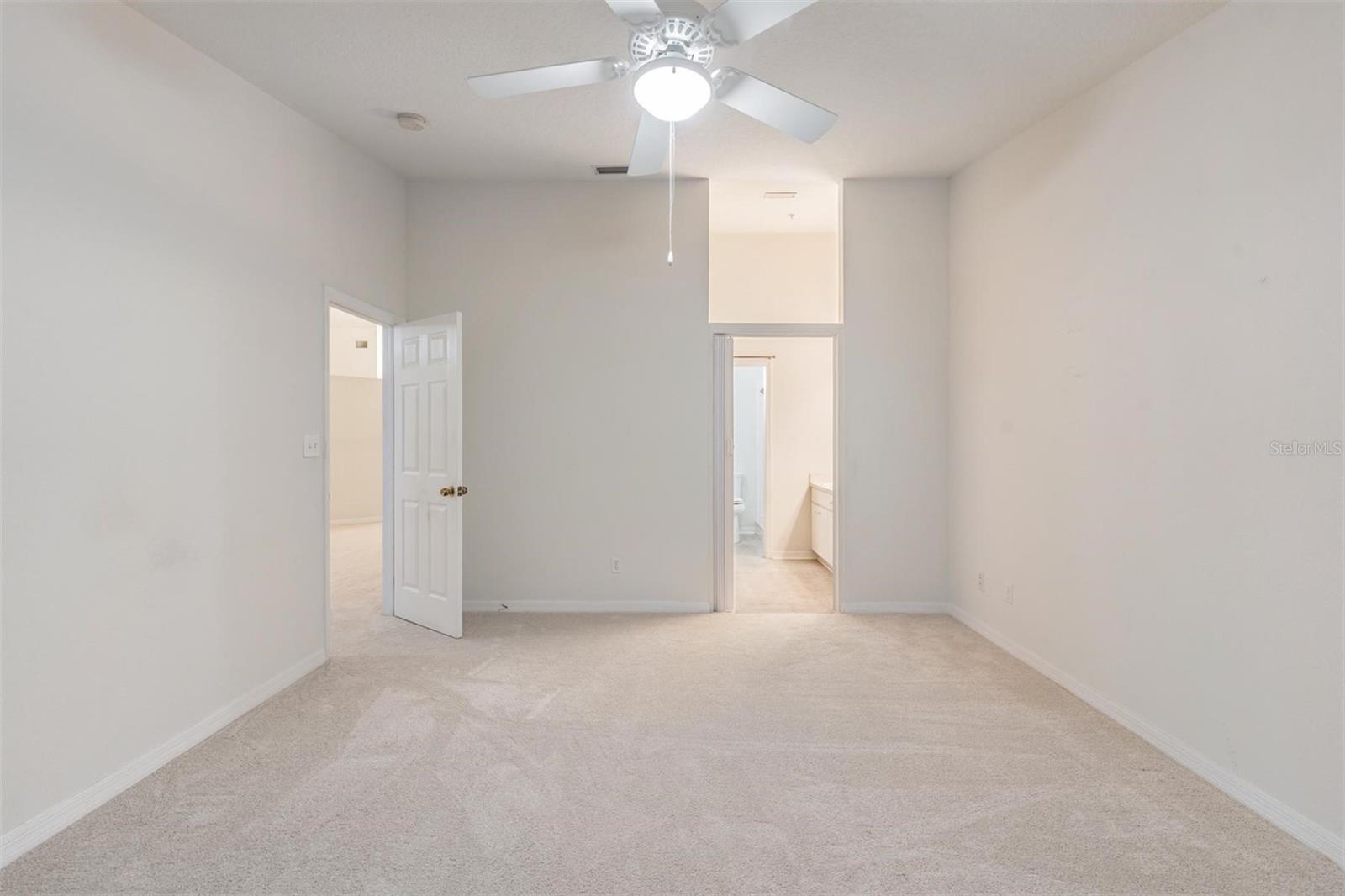 Master Bedroom, New Carpet and Ceiling Fan with light fixture.