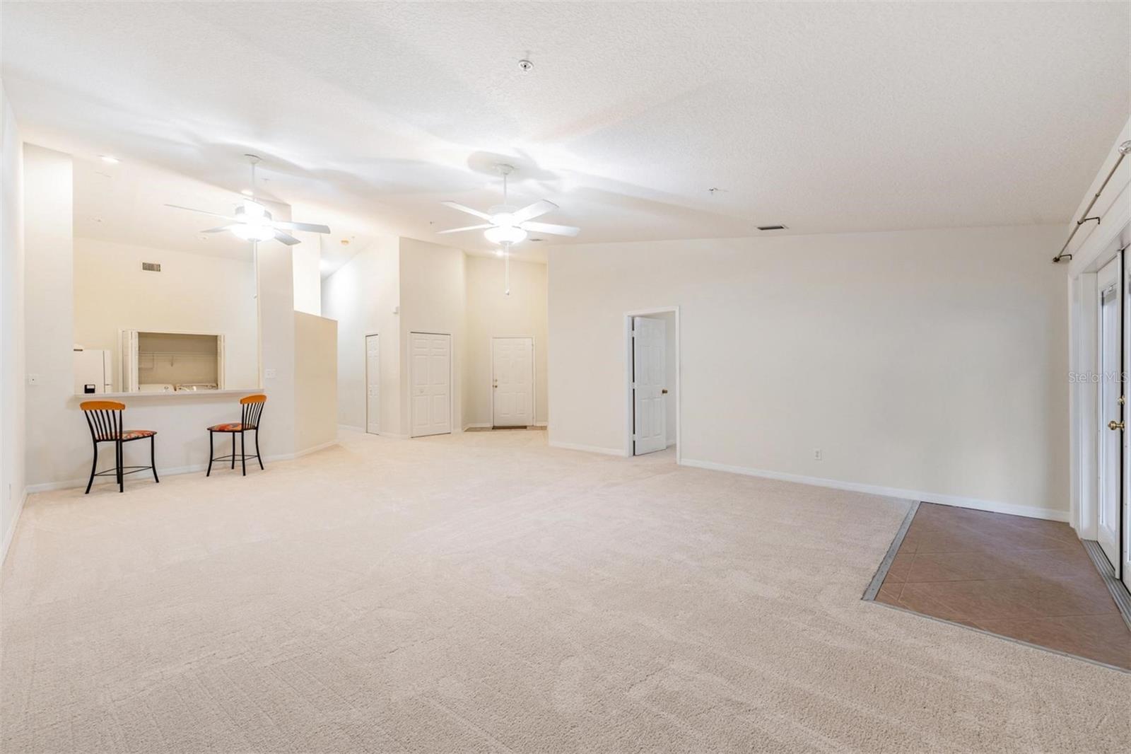 French Doors to the lanai, All New Carpet, Vaulted Ceilings, Ceiling Fans with light fixture.