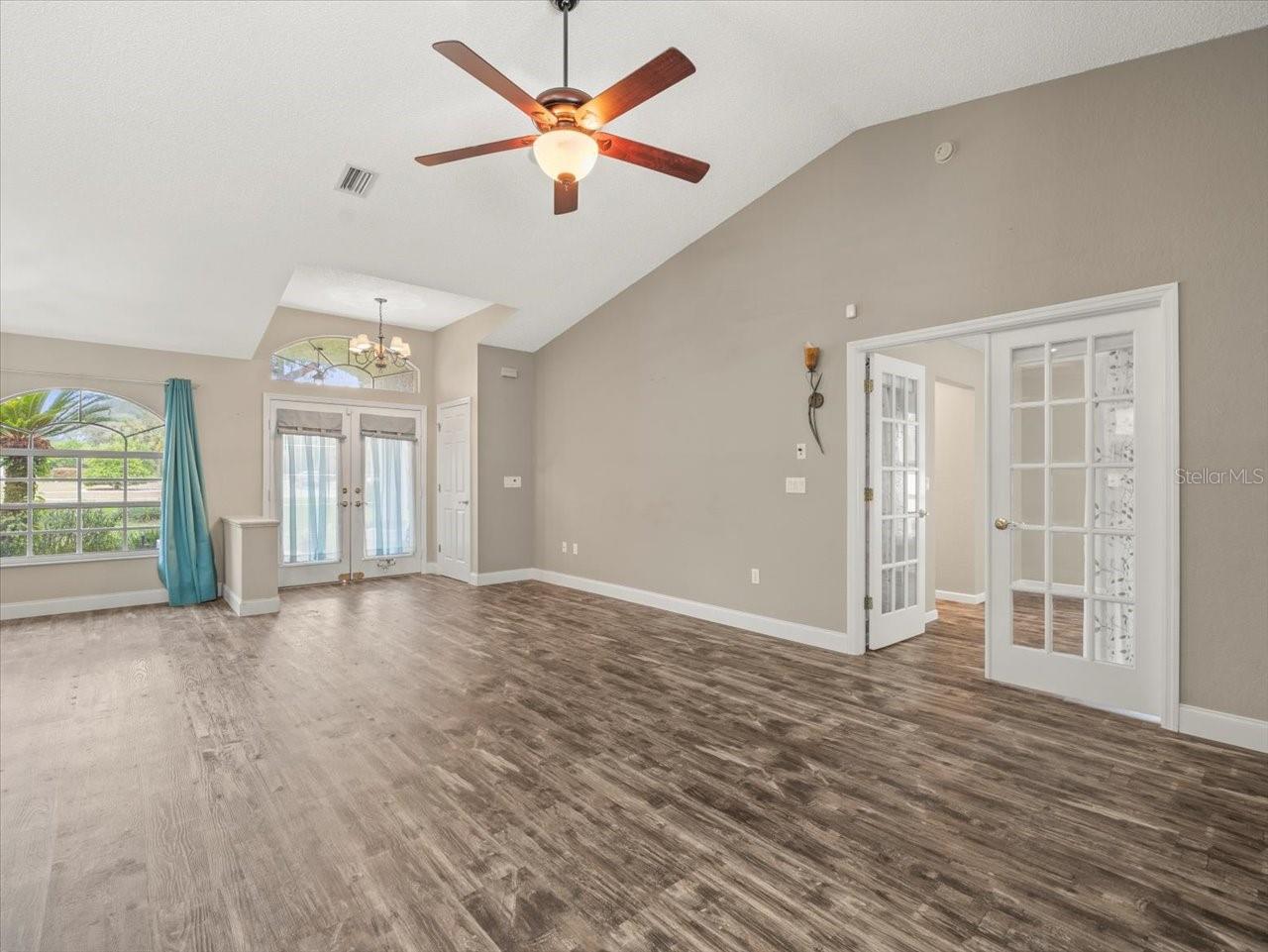 Living Room with Primary Bedroom Doorway