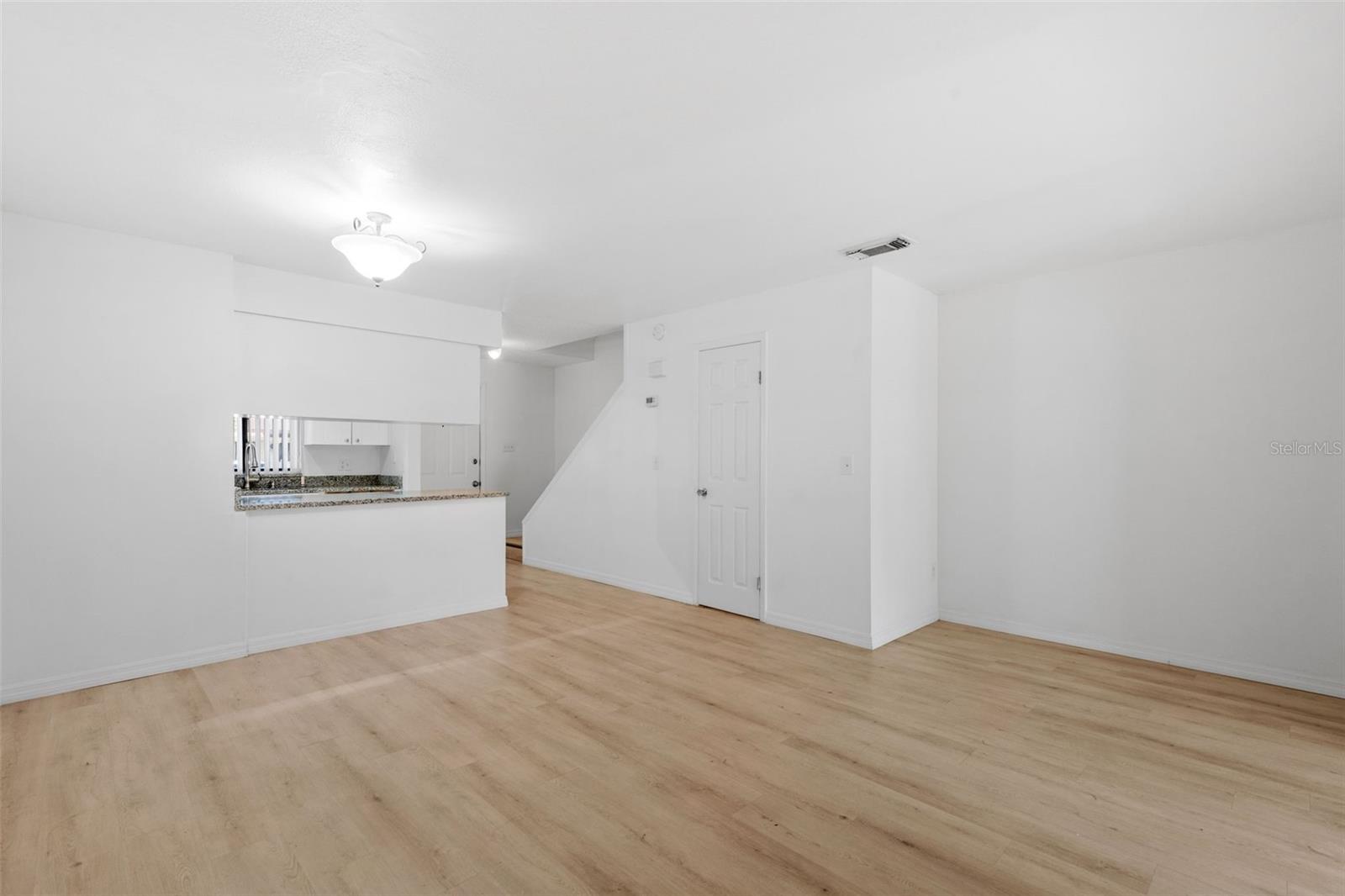 Living R /Half bath/ kitchen view