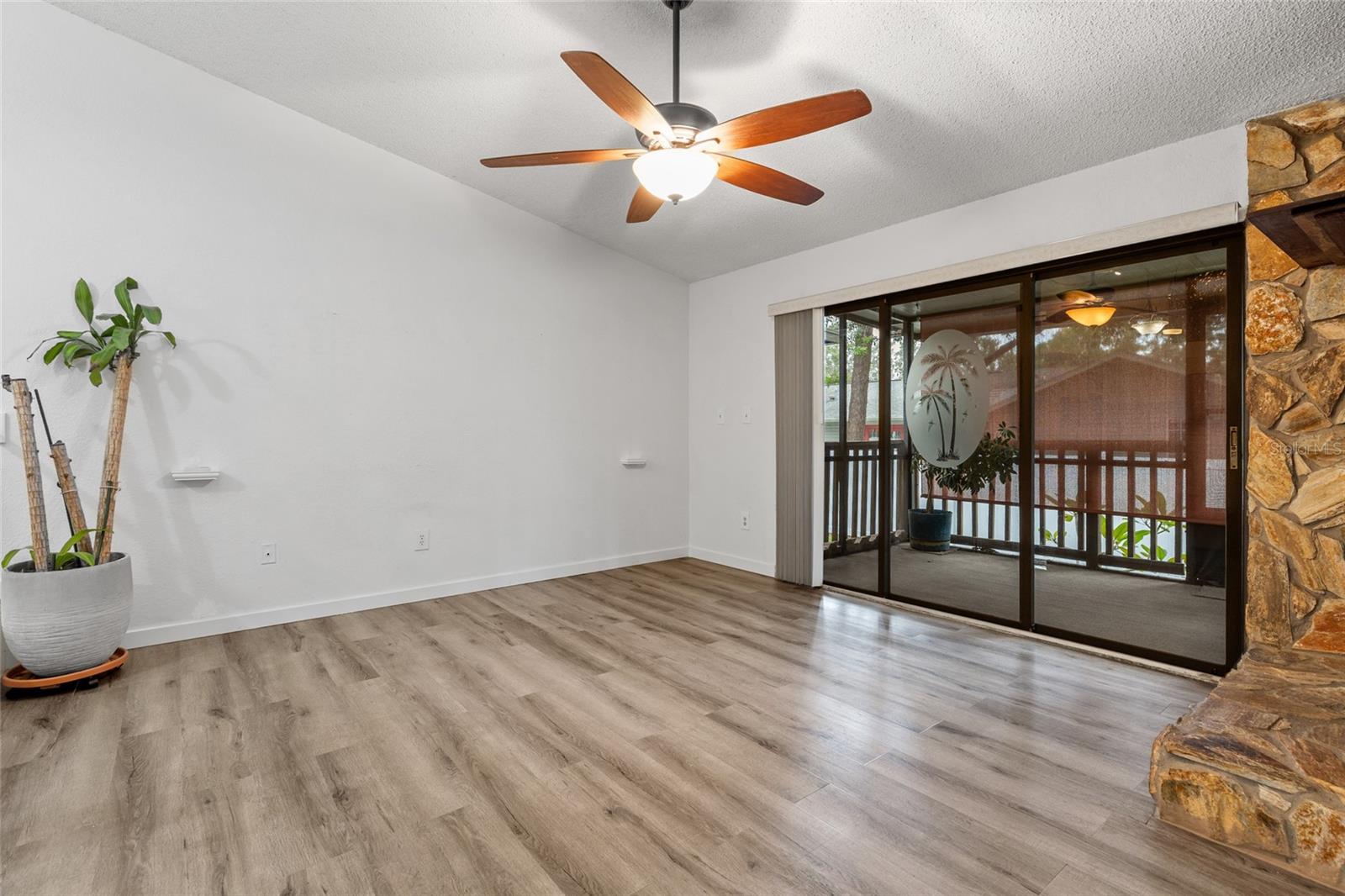 Living room and screened porch.