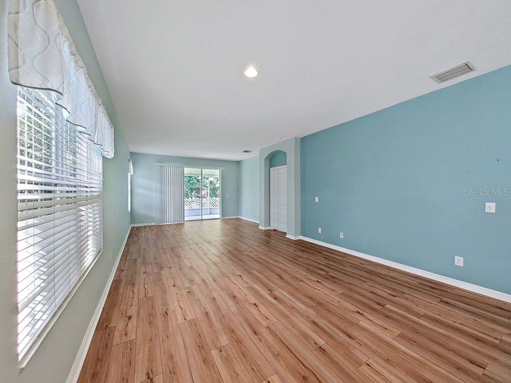 Large Living Room with Sliding Glass Doors to Exterior Lanai
