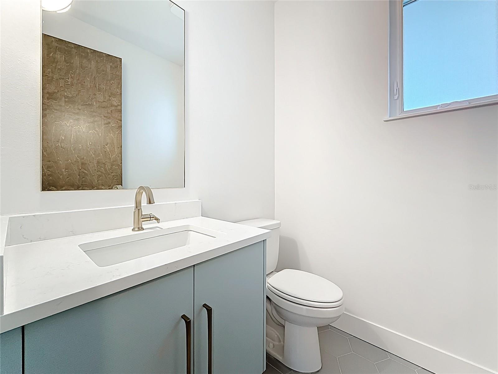 Main-level powder room for guests.
