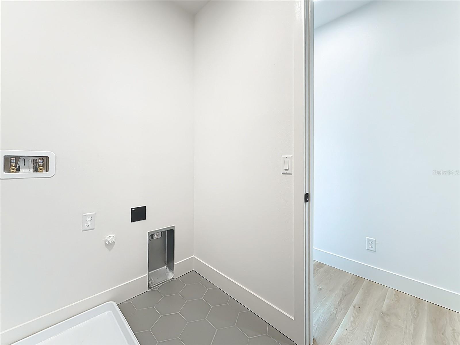 Laundry room with washer and dryer hookups, located on the 2nd floor.