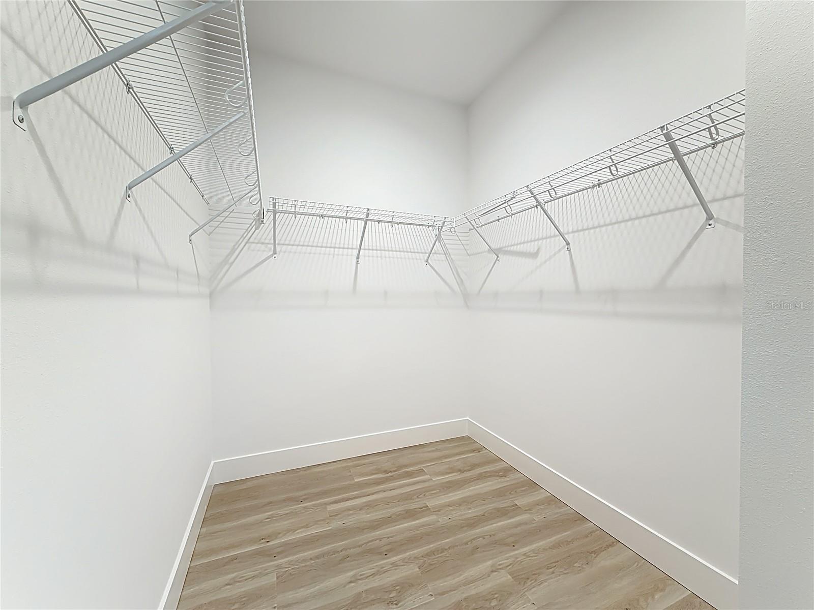 Primary suite walk-in closet.