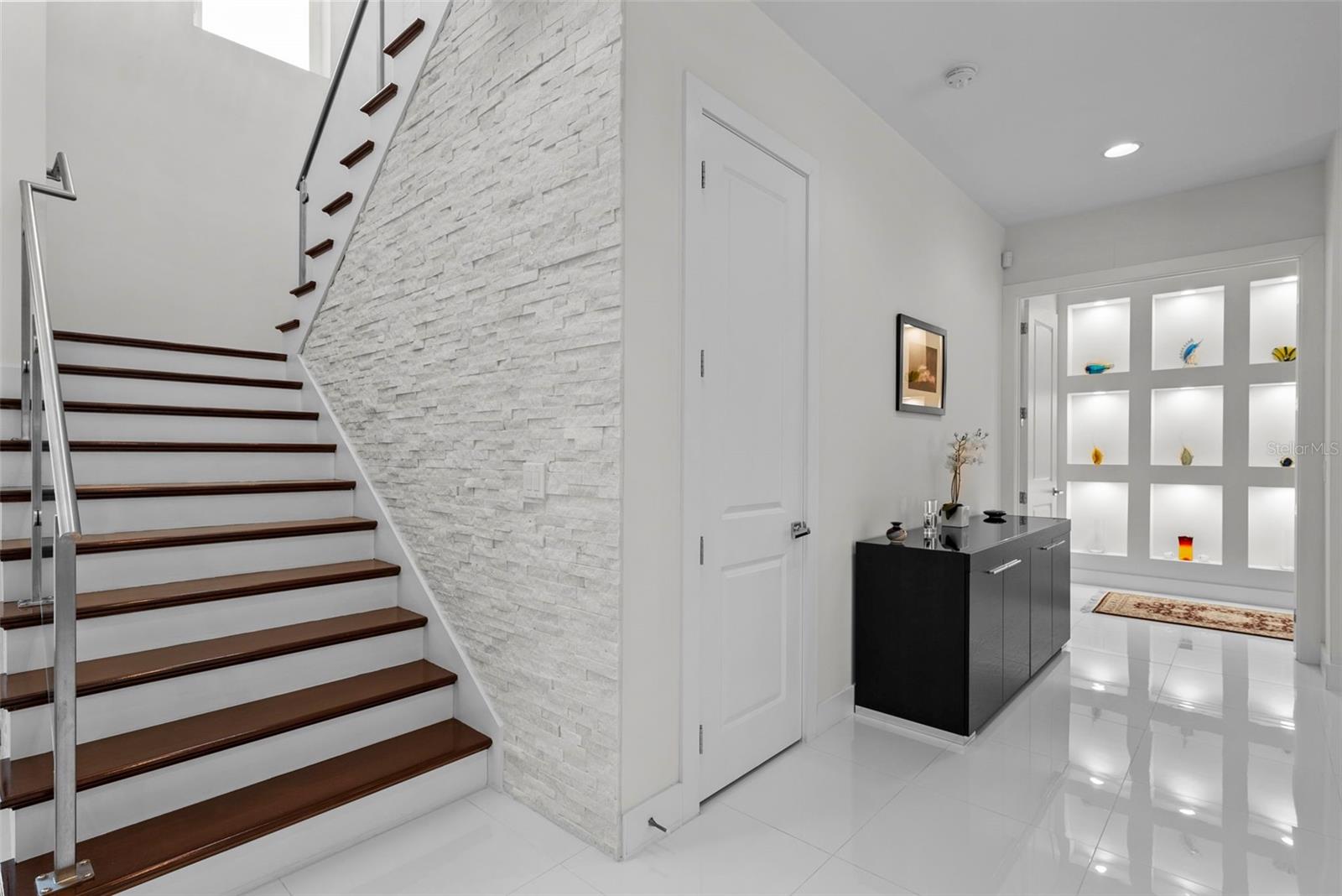 Glass paneled rails and a stone with stone accent walls