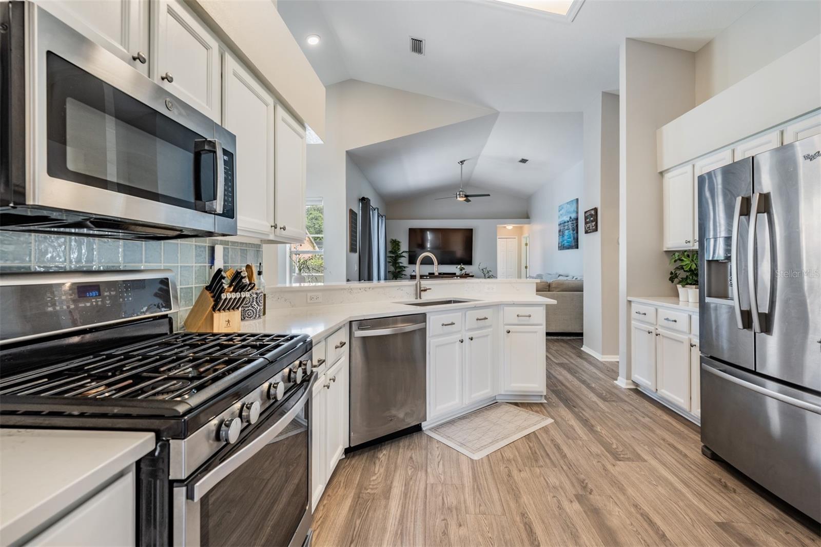 Open Kitchen, Stainless Steel appliances with Gas Stovetop, New Counter Tops, New Flooring