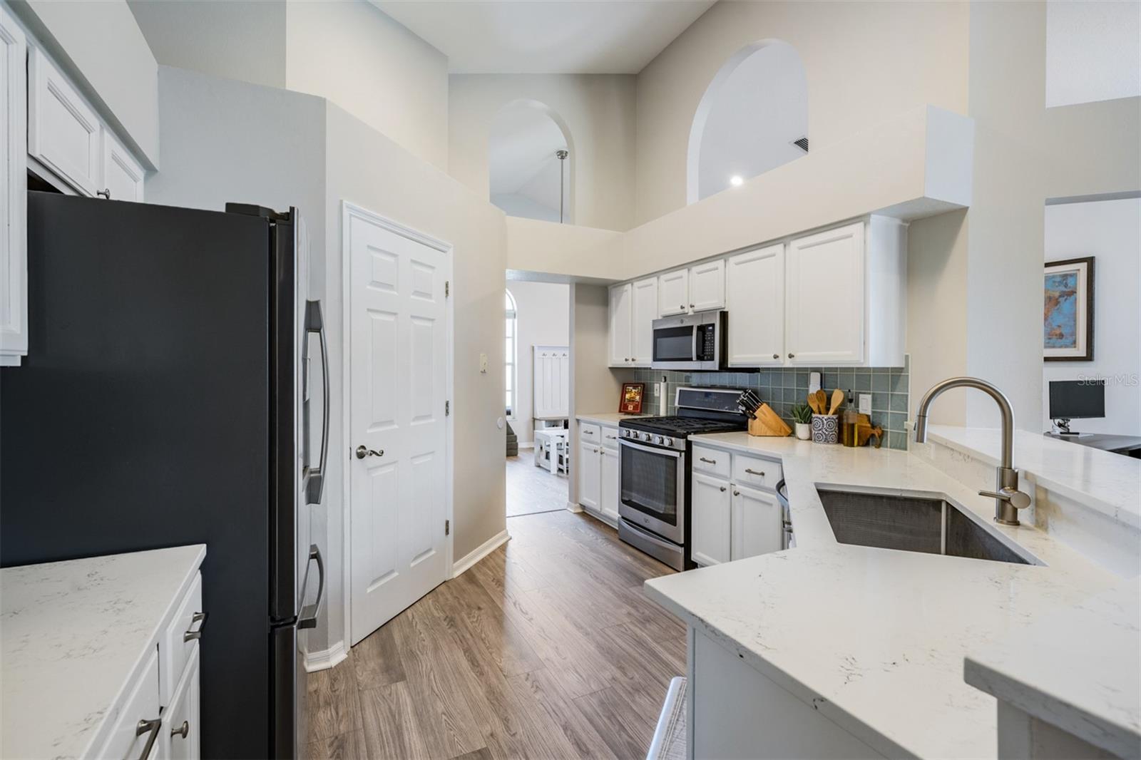 Open Kitchen, Stainless Steel appliances with Gas Stovetop, New Counter Tops, New Flooring, Pull Out Drawers, New Cabinets