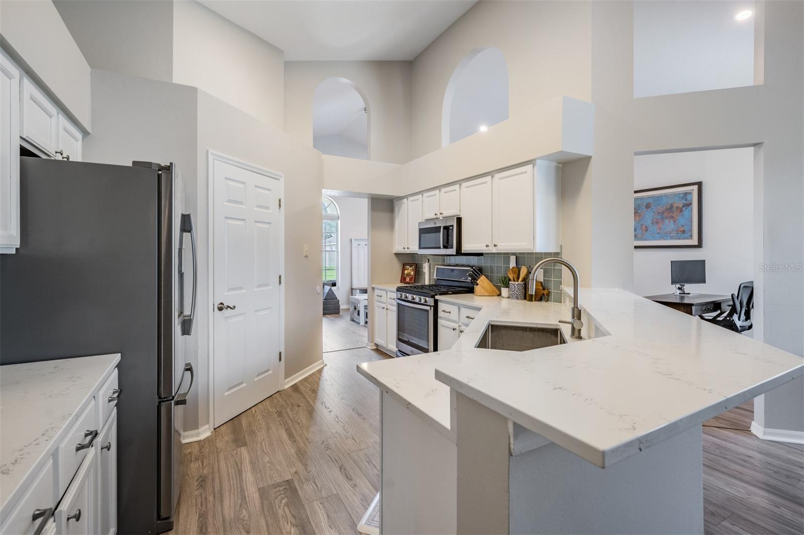 Open Kitchen, Stainless Steel appliances with Gas Stovetop, New Counter Tops, New Flooring, Pull Out Drawers, New Cabinets