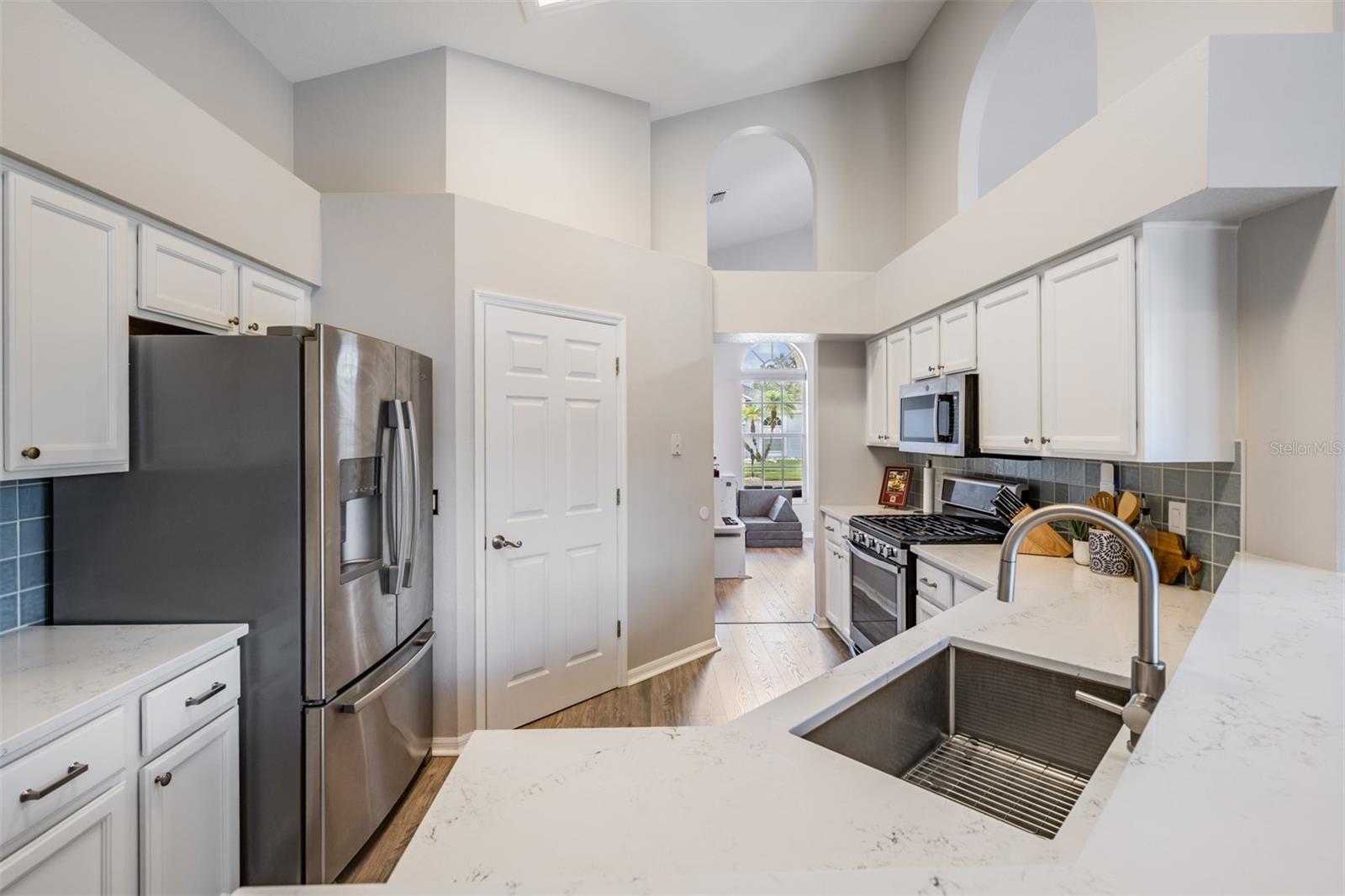 Open Kitchen, Stainless Steel appliances with Gas Stovetop, New Counter Tops, New Flooring, Pull Out Drawers, New Cabinets