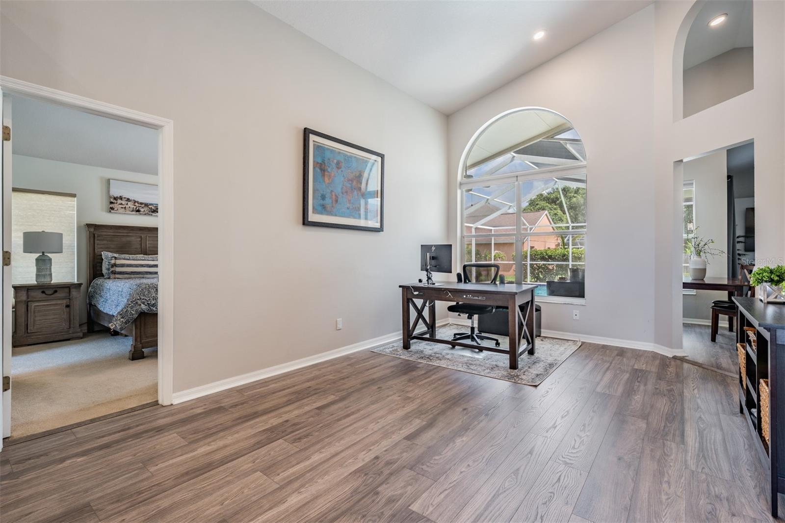 Living Room area, New Flooring, Vaulted Ceilings and inset lighting.