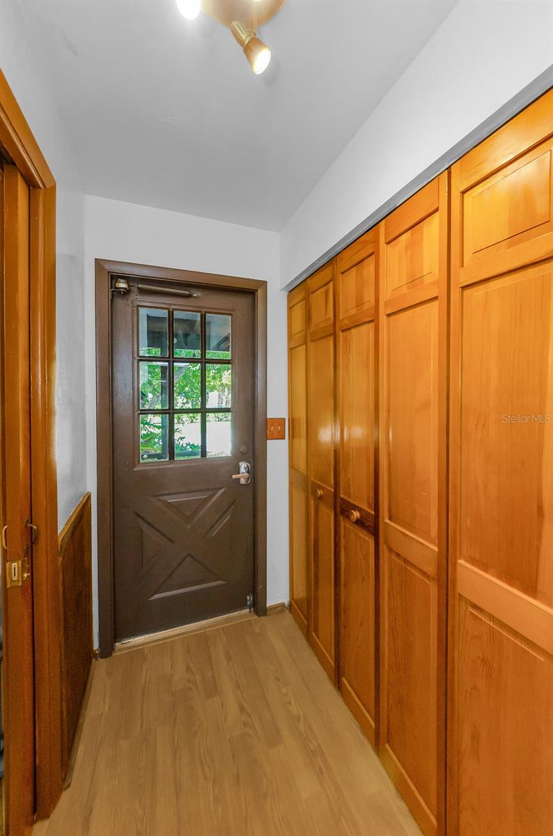 Foyer of home with large storage pantry/closet