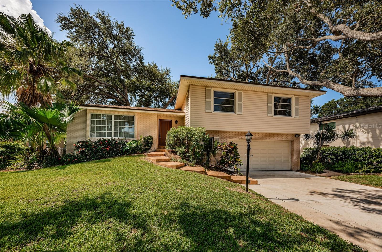Front view with 2 car garage
