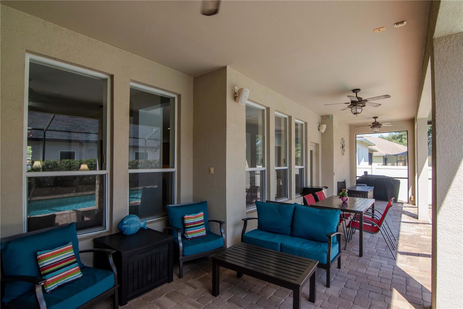 Covered and Screened Lanai with Pavered Flooring and Triple Ceiling Fans