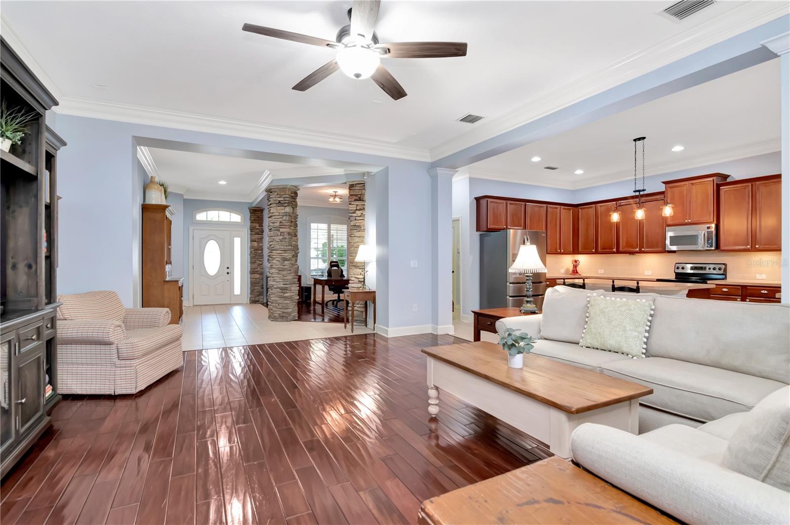 Living Room with Wood Floors and View to Entry/Kitchen