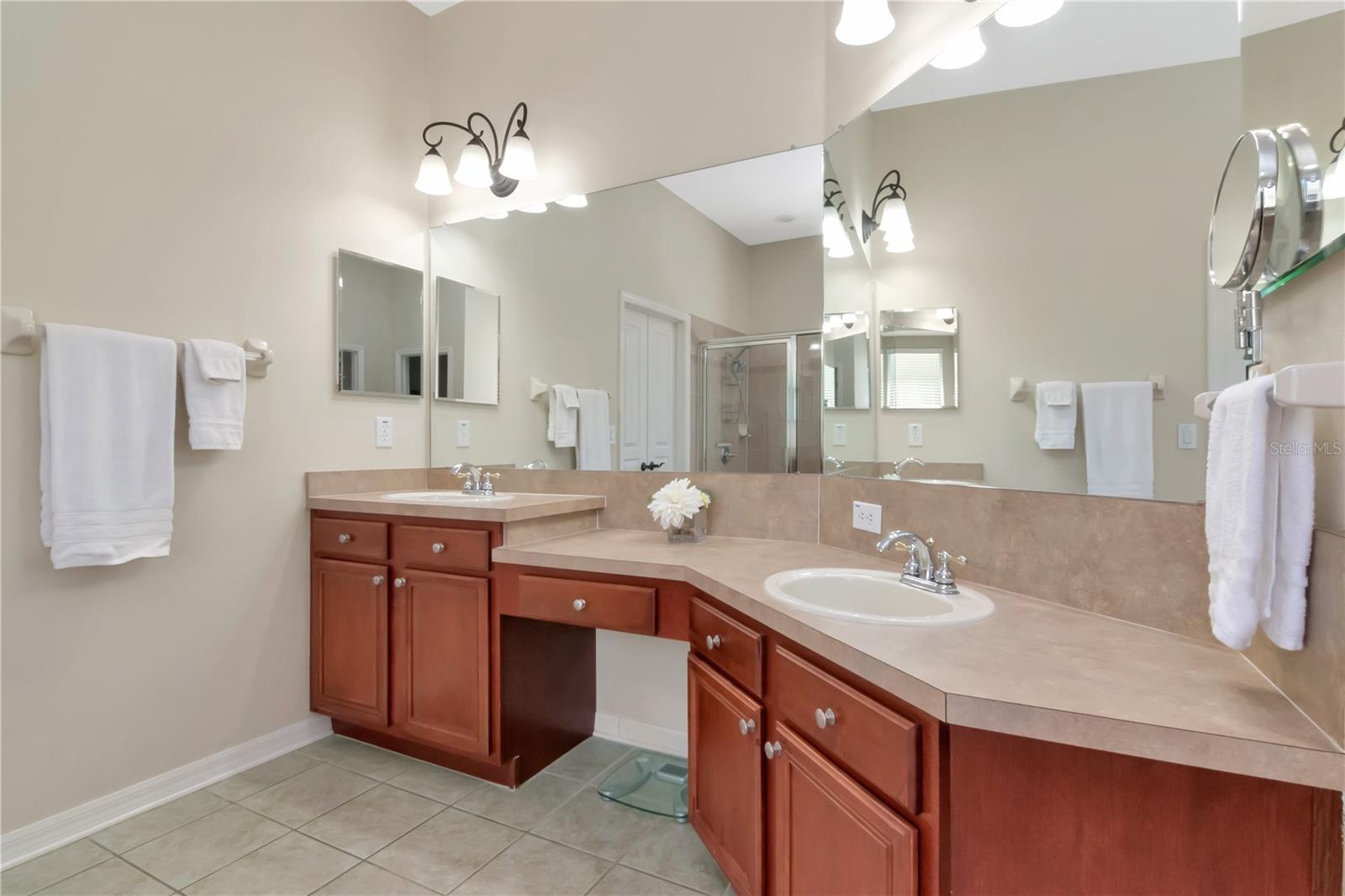 Primary Bathroom with Dual Sinks and Vanity Space