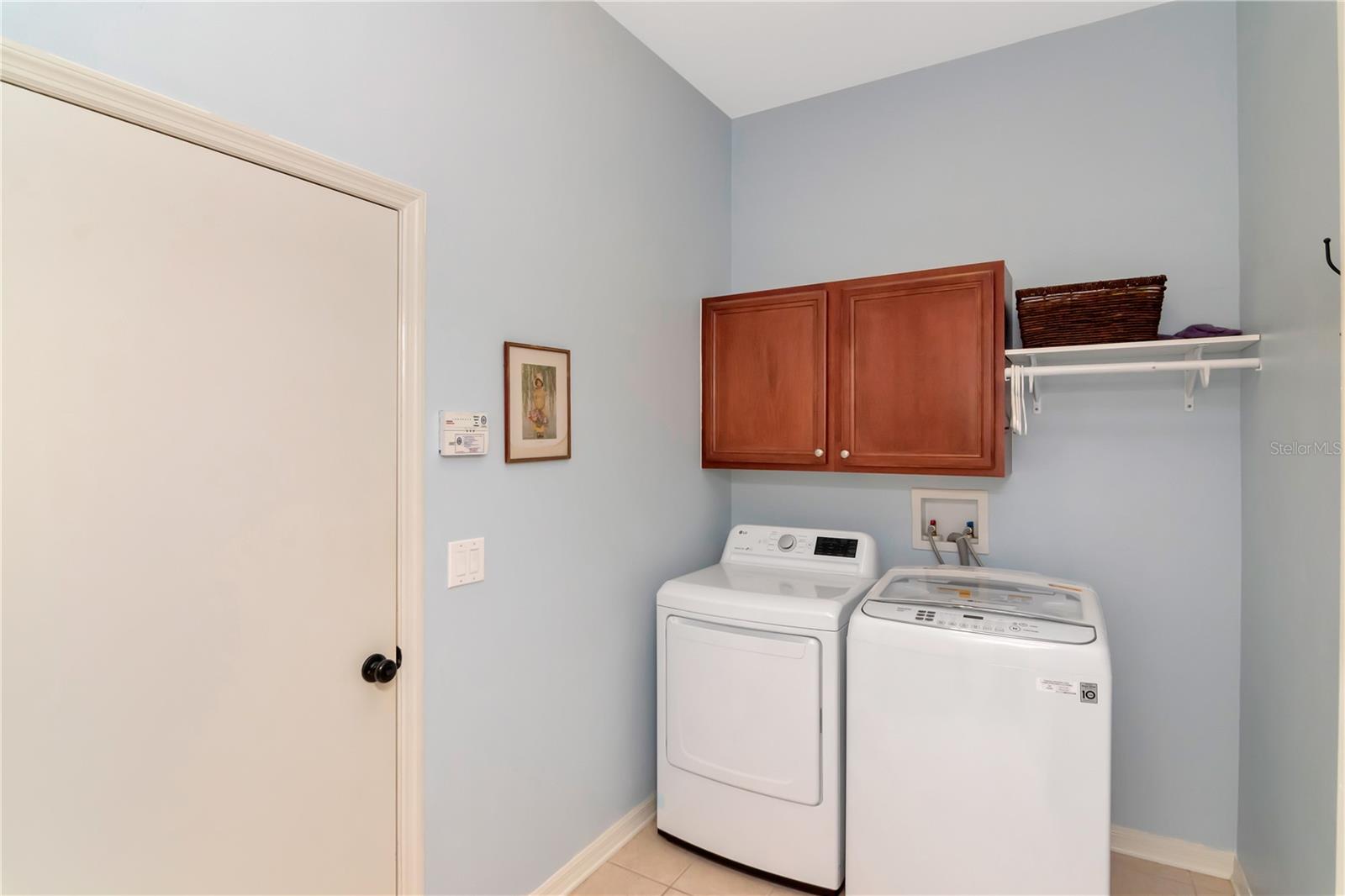 Inside Laudry Room with Cabinets & Access to the Garage