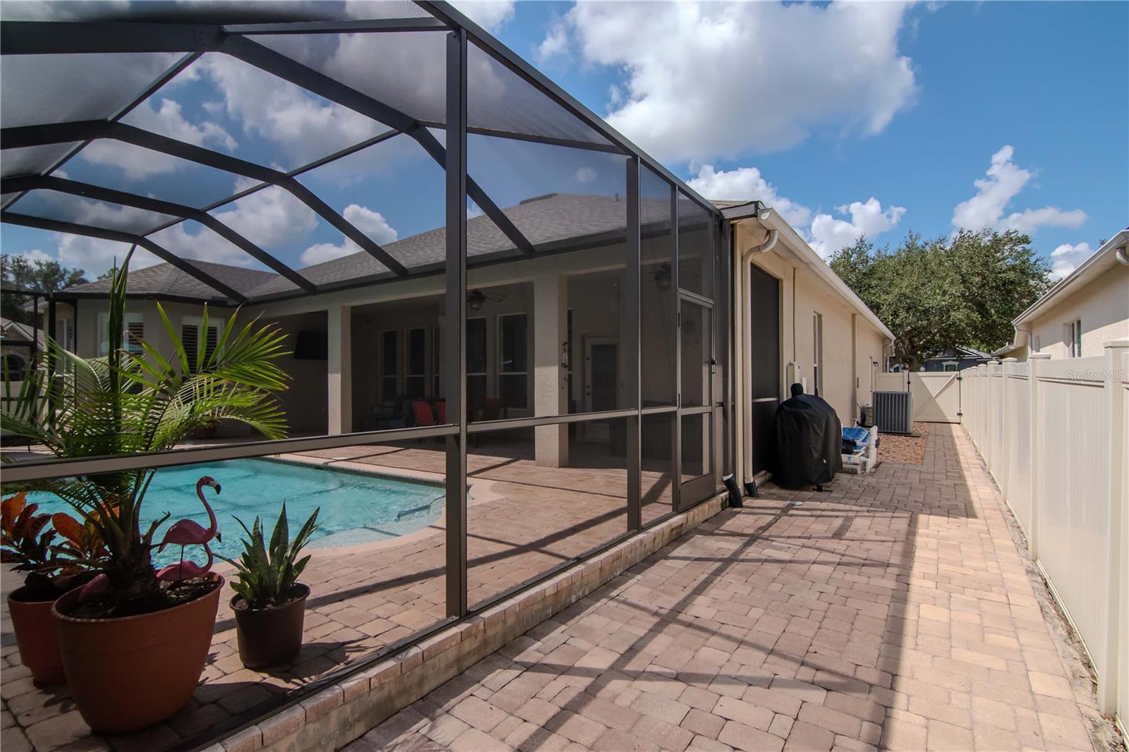 Side View of Home with Pavered Side Yard