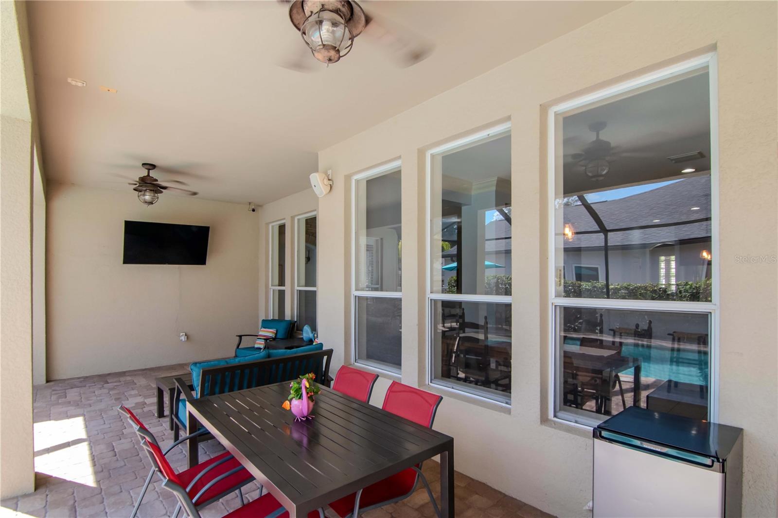 Covered and Screened Lanai with Pavered Flooring and Triple Ceiling Fans