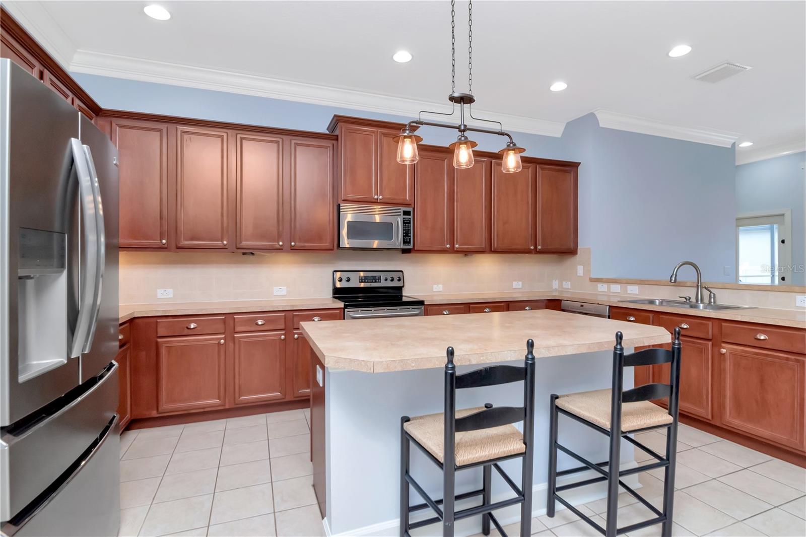 Kitchen with Island and Extra Seating, Breakfast Bar, Stainless Steel Appliances, Counter/Storage Space