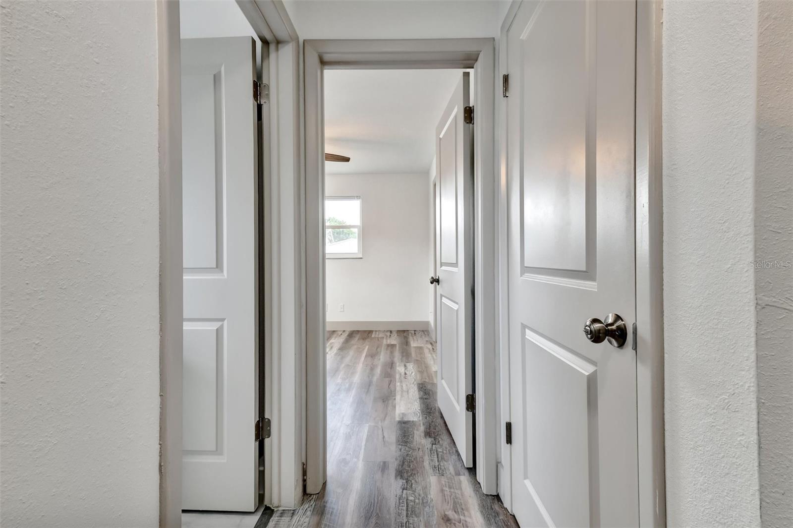 hallway to bath 2 on left, bedroom 3 ahead and linen closet on right