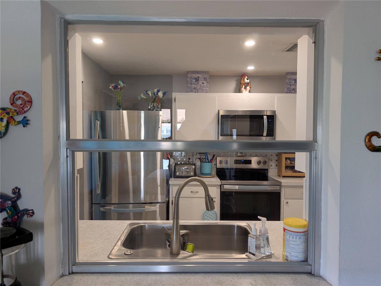 Pass thru window to kitchen makes casual dining more convenient.