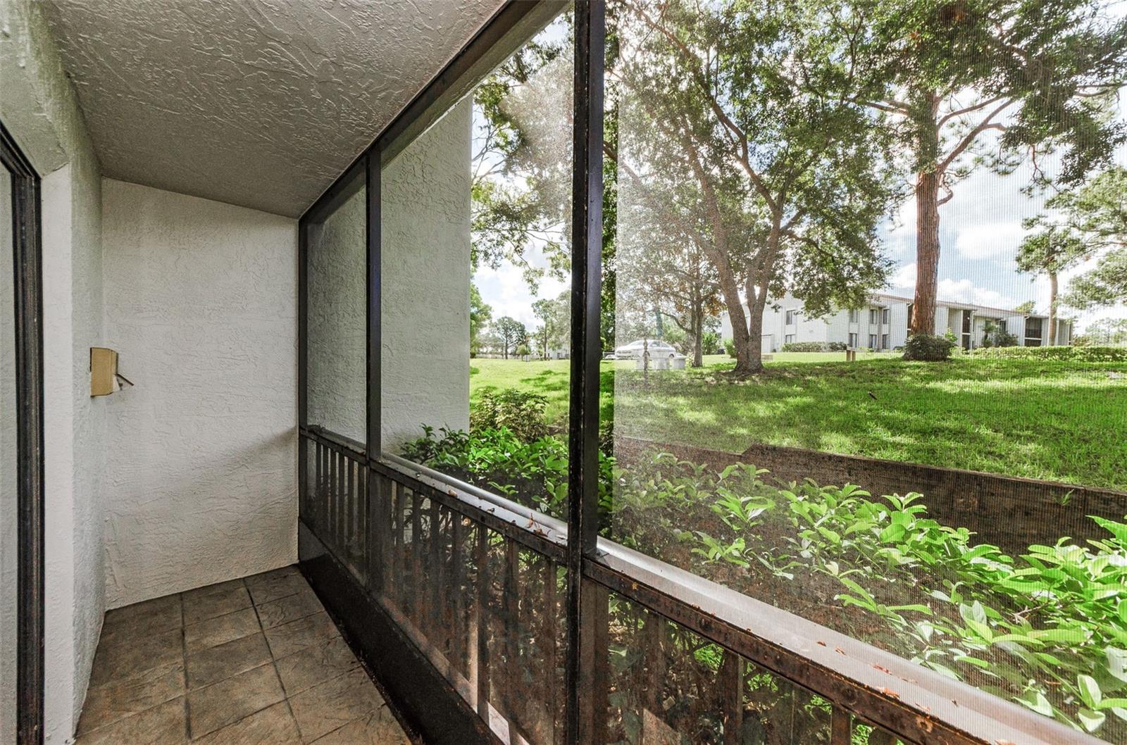 Screened and Covered Porch with serene views.