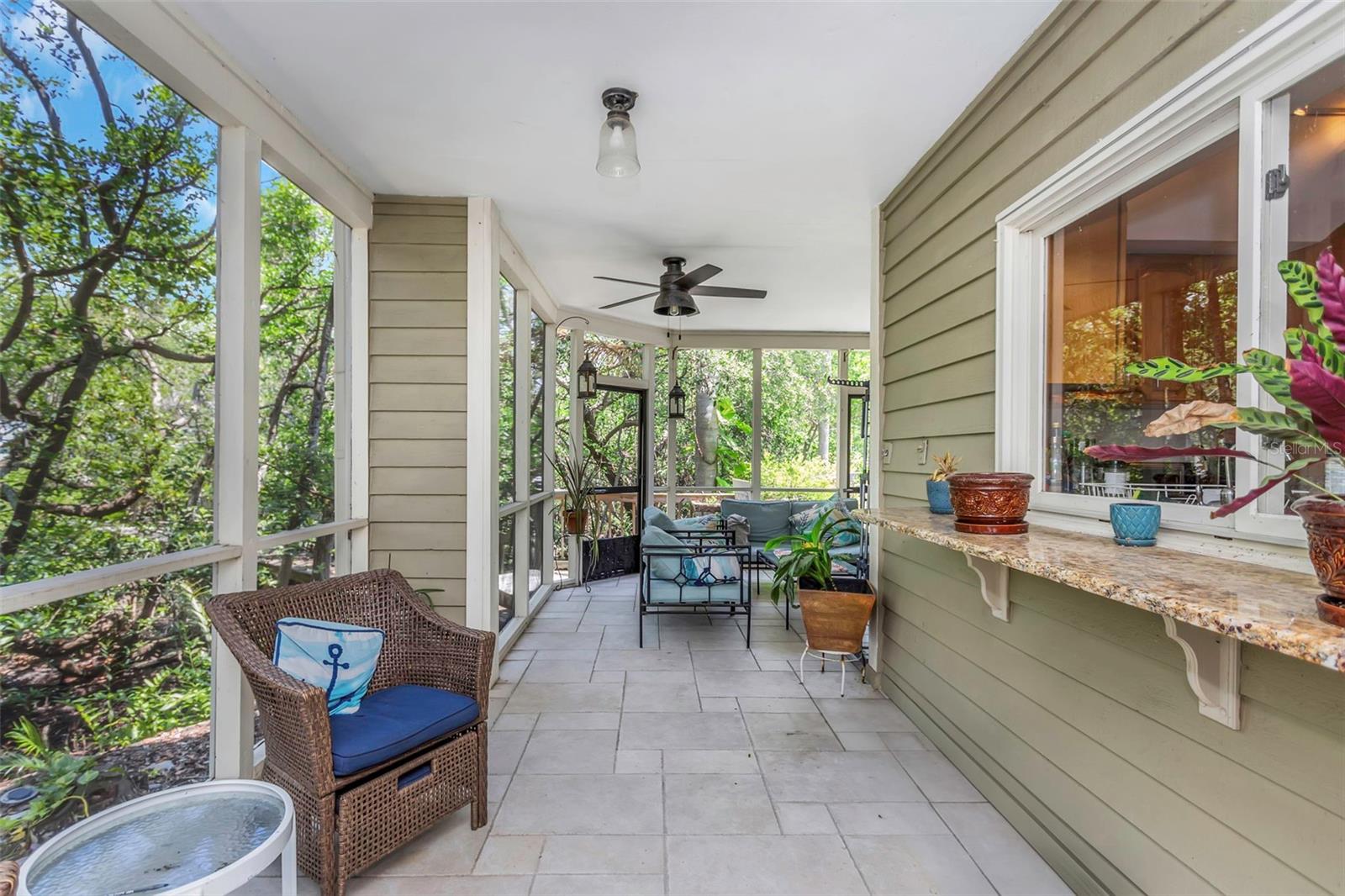 Outdoor living and dining room with pass thru