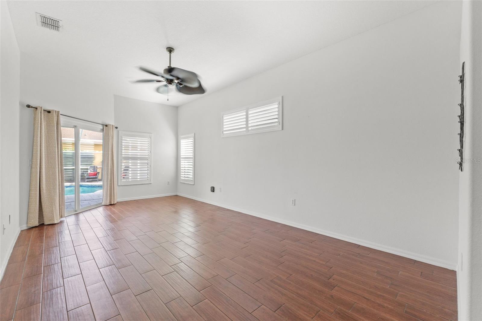 Expansive primary suite with calm, neutral finishes