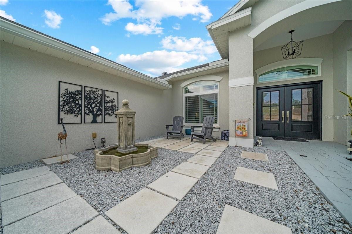 Elegant double doors with covered entry