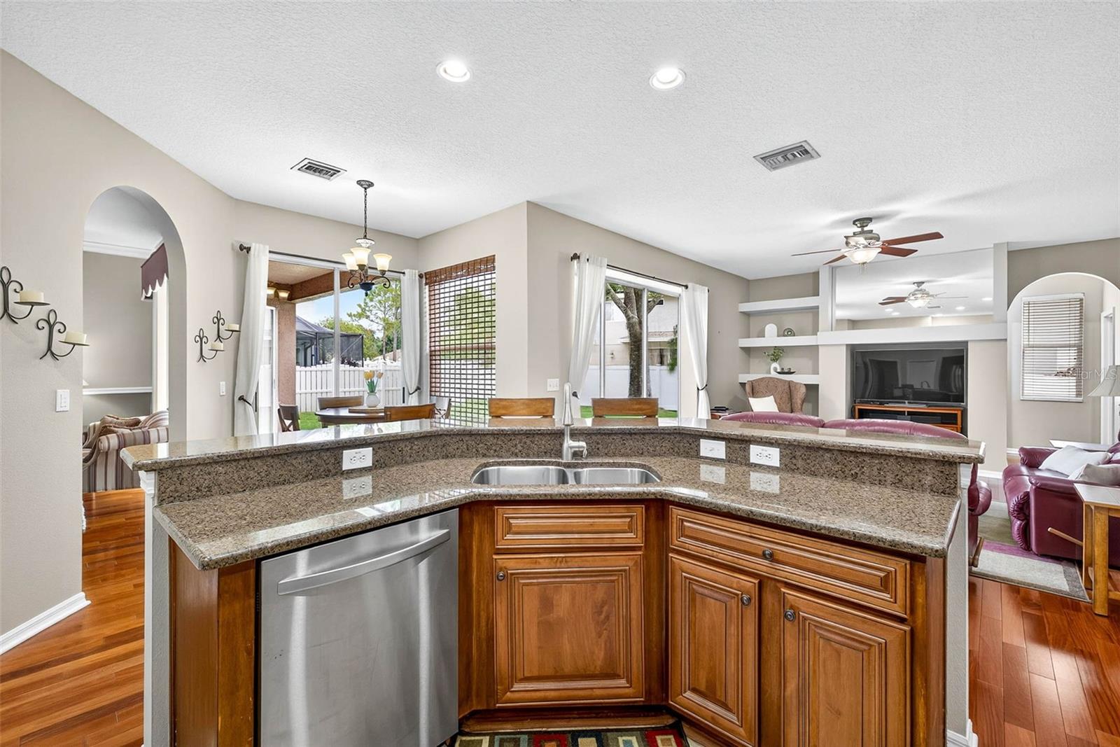 Granite counters, wood cabinetry and stainless appliances