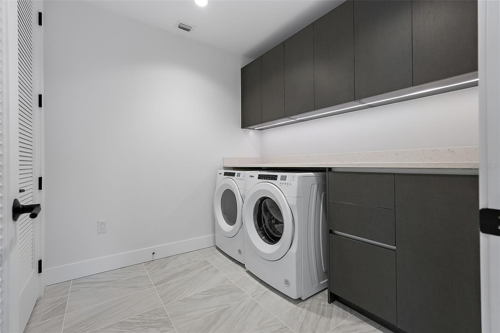 True Laundry Room, with storage closet and folding shelf
