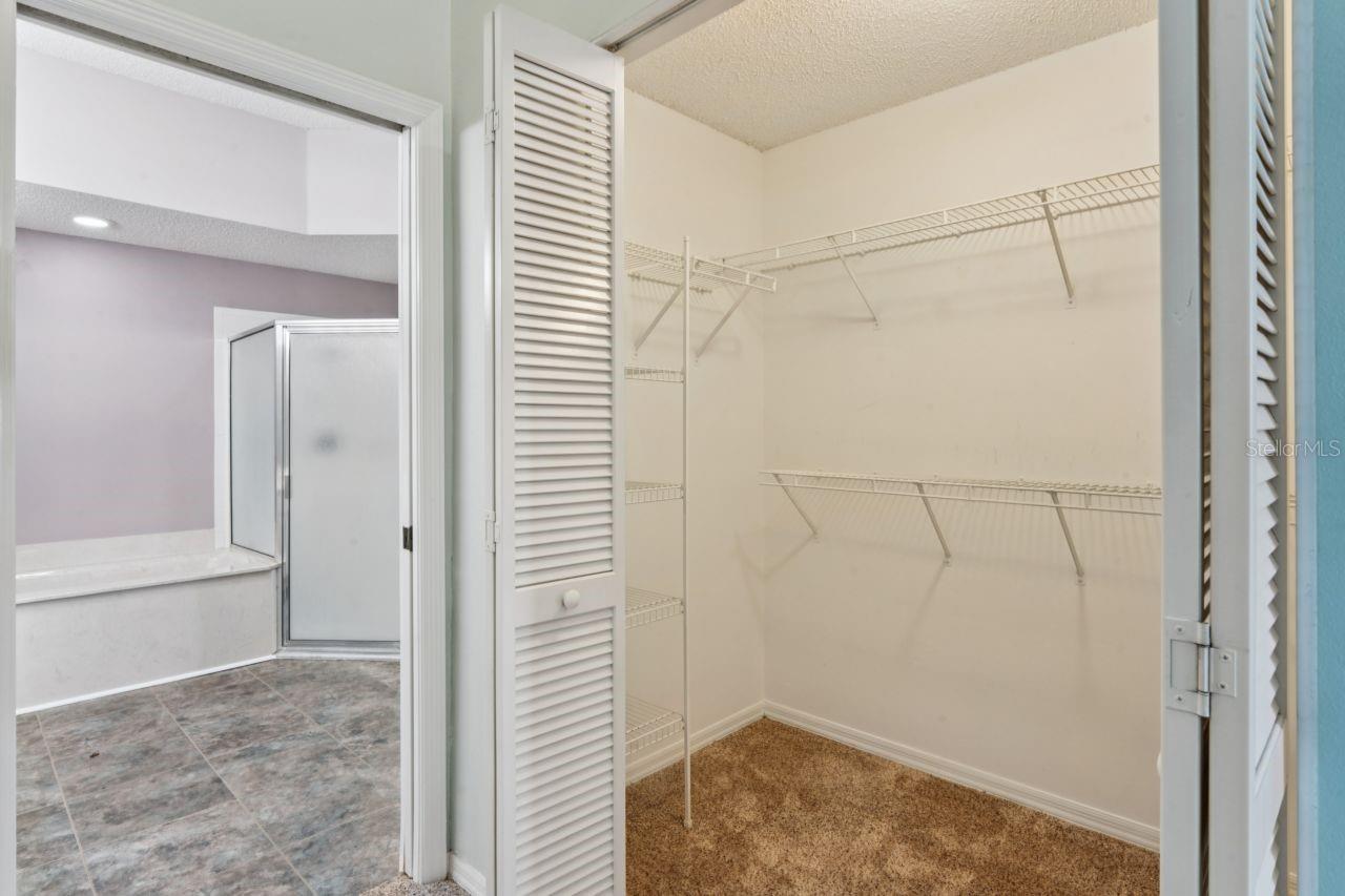 primary bedroom showing one of the two closets