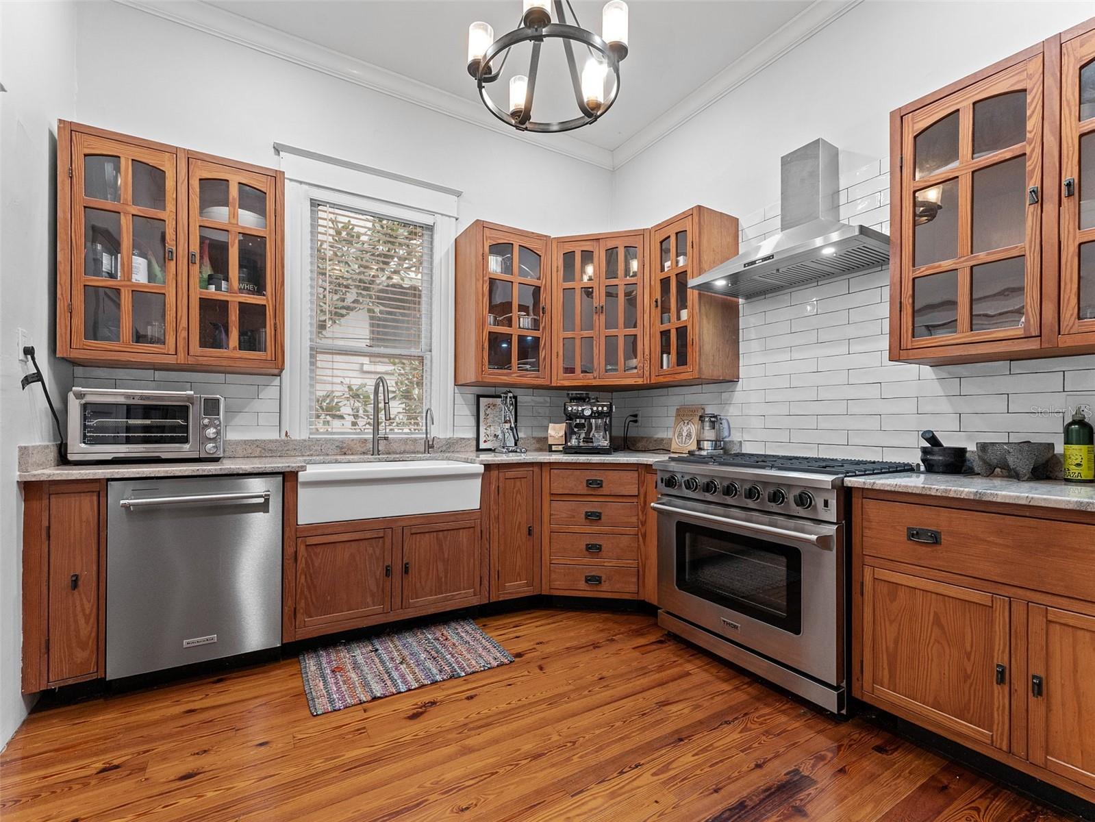 Renovated kitchen with farmhouse sink and pantry