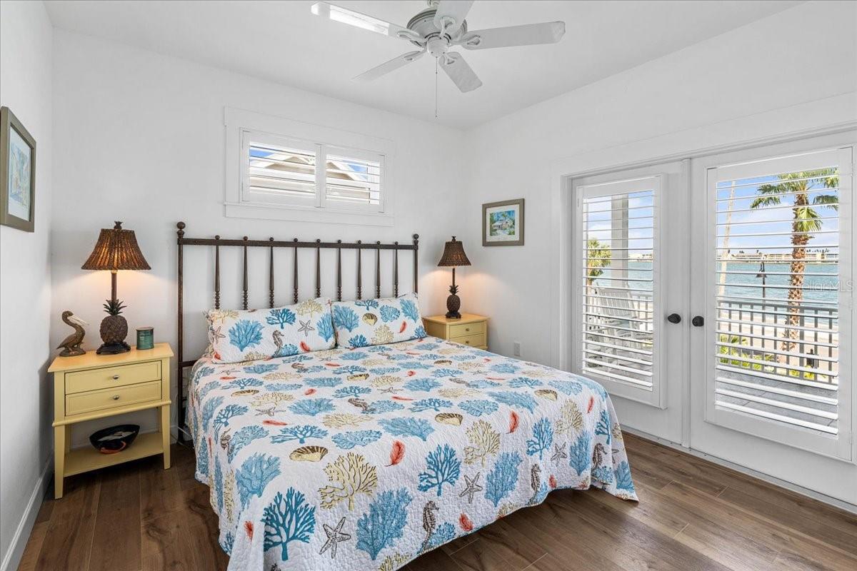2nd Floor:  Second Bedroom, French Doors with Plantation Shutters lead to Patio.
